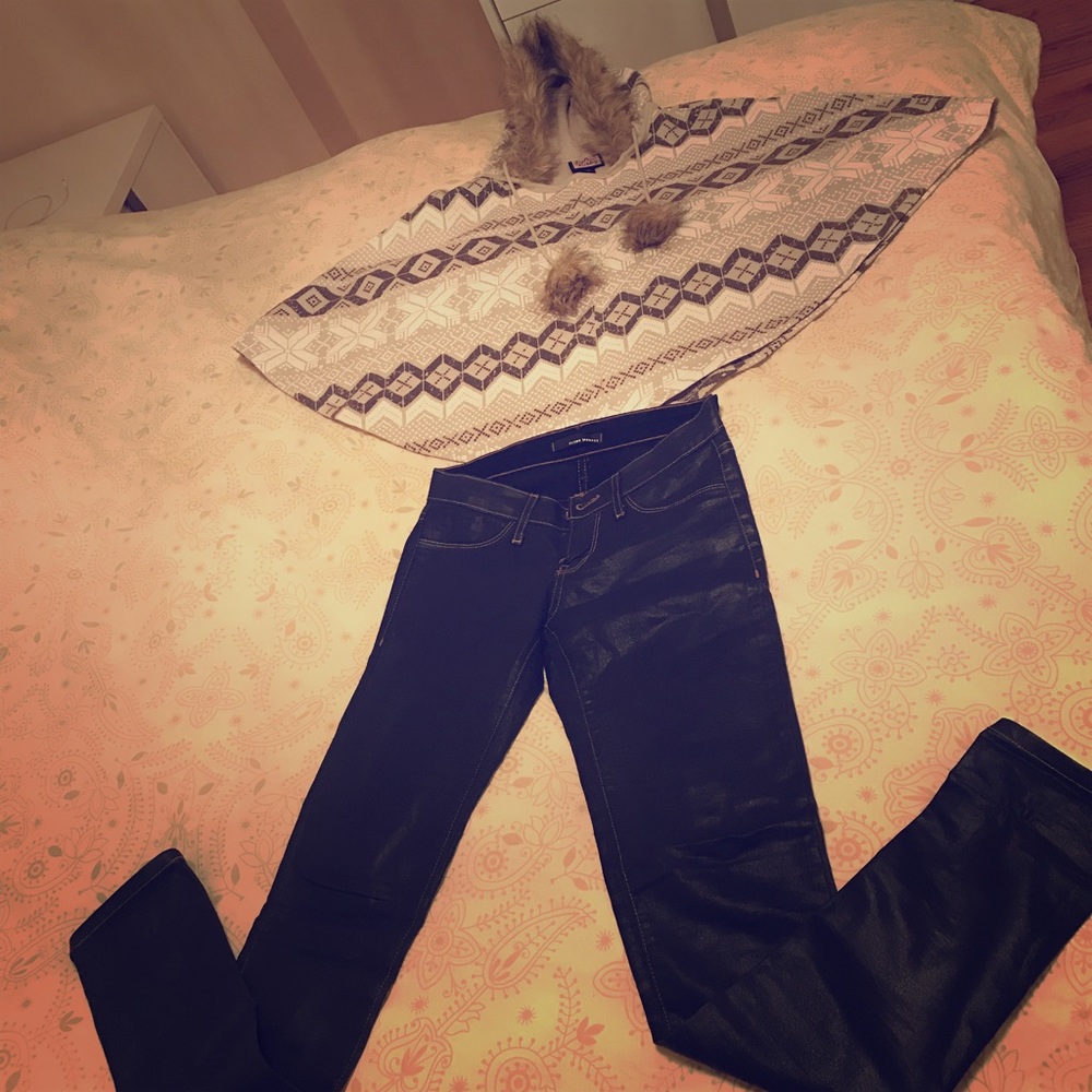 Warm keeping poncho and leather jeans are for sale